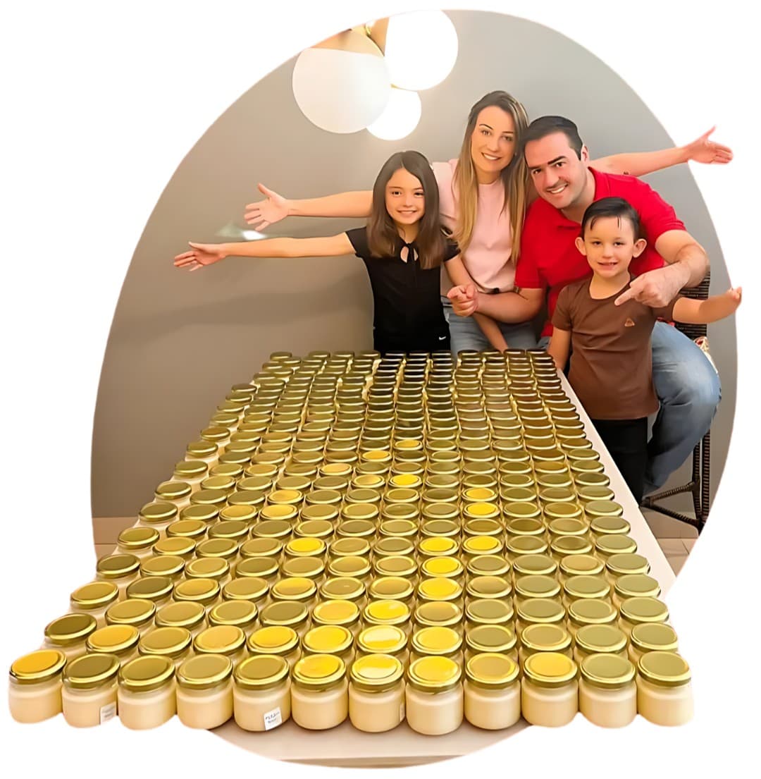 Priscila Marçal com a família, ao lado da mesa de pudins